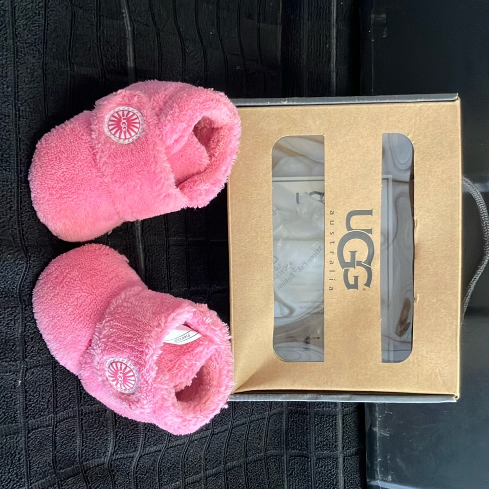 Infant UGG’s pink in box . Somebody’s baby needs these for winter .